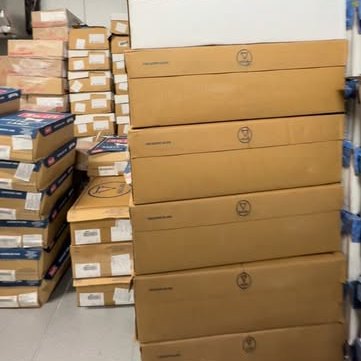 Stacked shipping boxes ready to leave the shop
