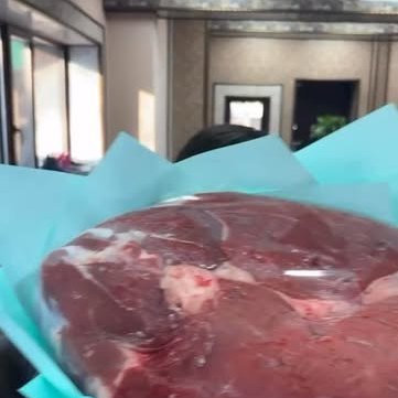 A packed order wrapped in blue paper