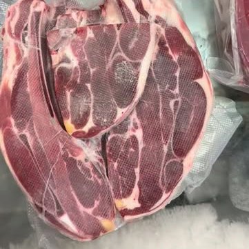 Vacuum-sealed cuts arranged on a shop counter
