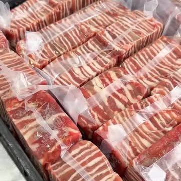 Rows of vacuum-sealed portions packed in trays